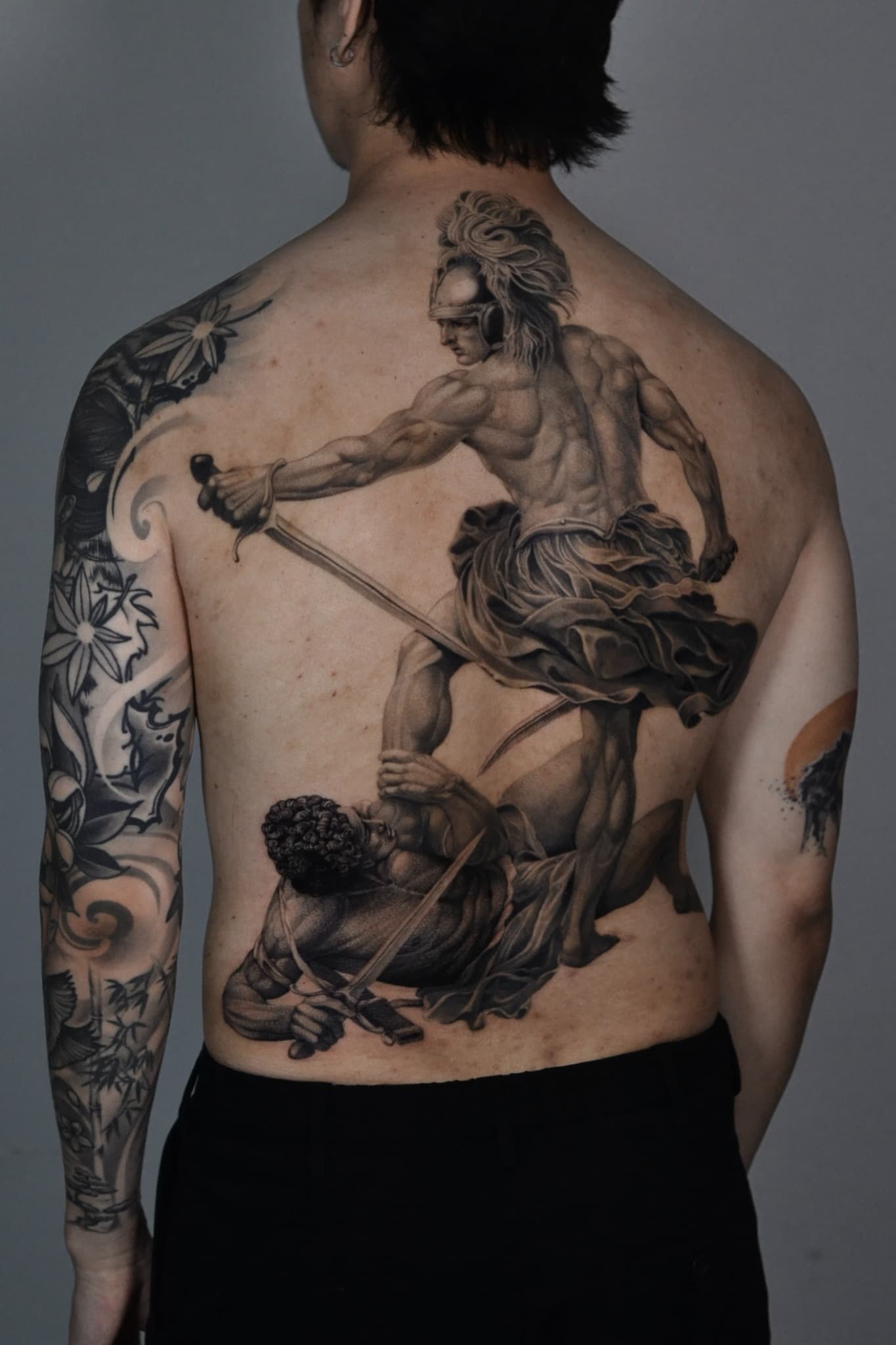 Black and grey classical warrior back tattoo by Tonymontattoo