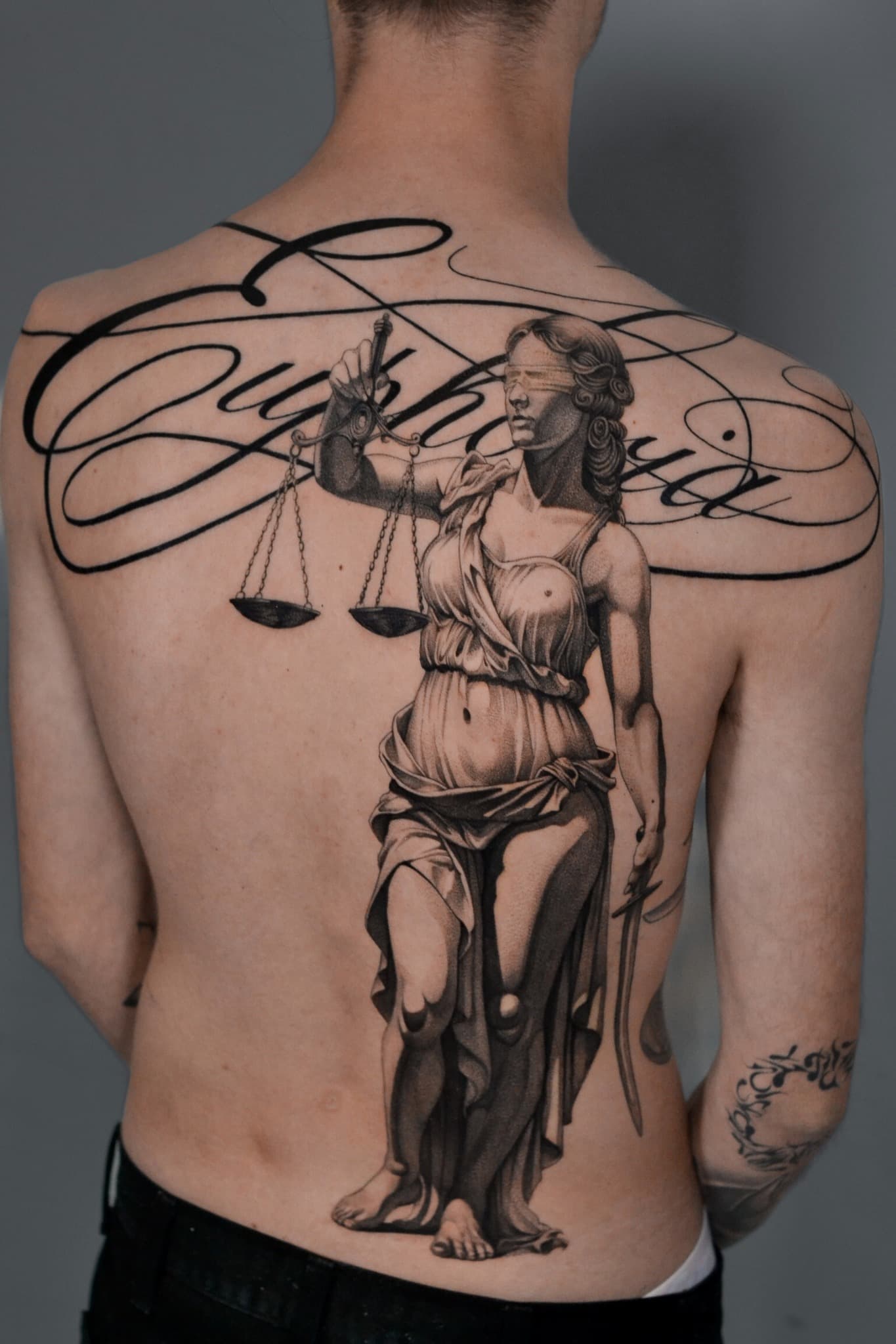 Large black and grey figurative back tattoo by Tonymontattoo